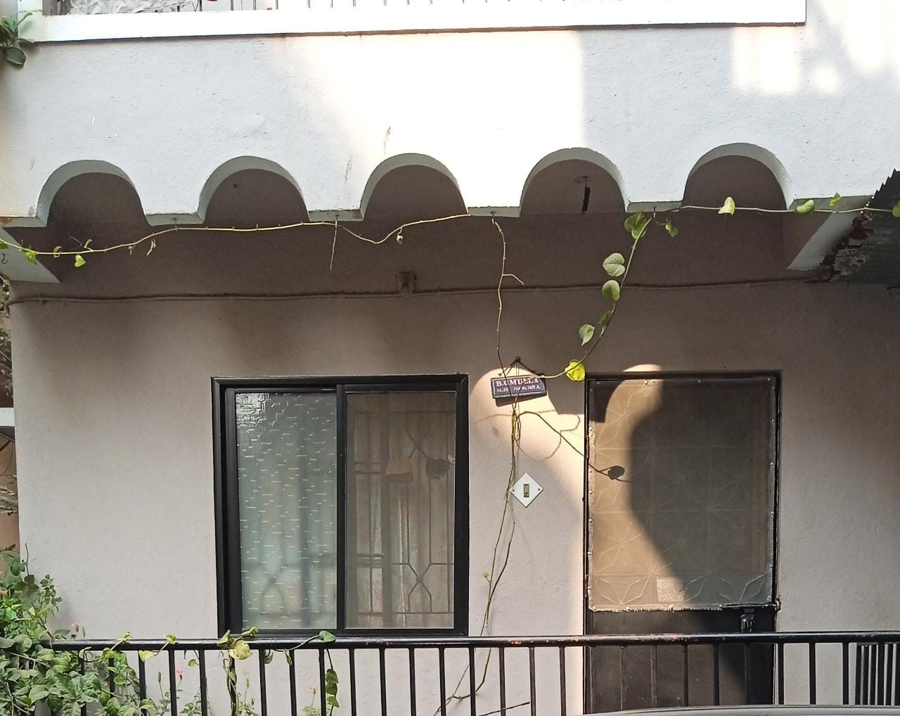 Building exterior of Queen Quatters PG behind PCCOE Sector 26 Nigdi